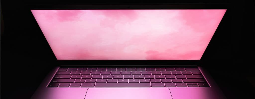 A laptop open on a desk